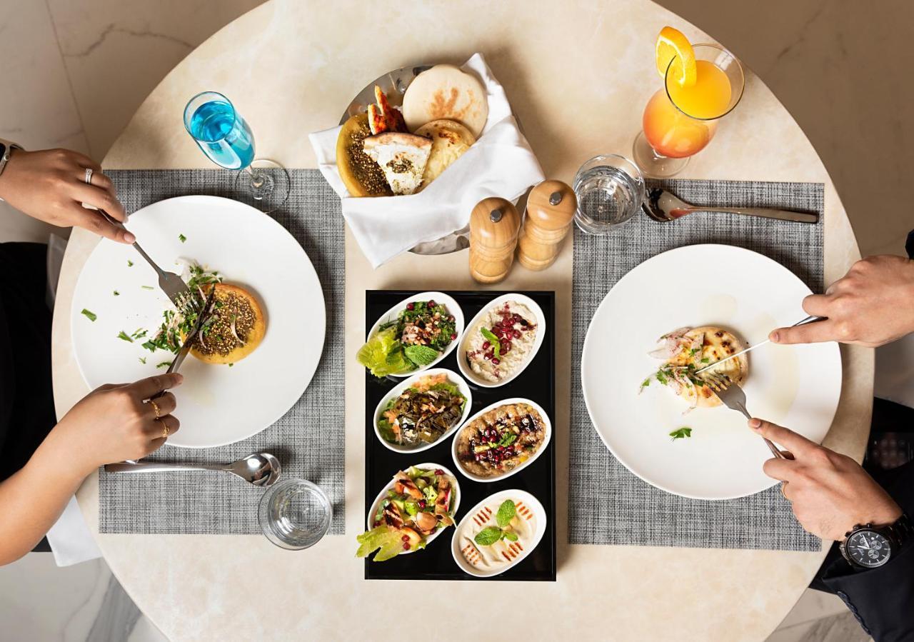 Asiana Grand Hotel Dubai Ngoại thất bức ảnh A selection of meze